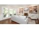 Bright and airy living room with fireplace and custom built-ins, open to outdoor patio at 6910 Green Turtle Dr, Charlotte, NC 28210
