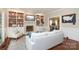 Spacious living room with fireplace, built-in bookshelves, hardwood floors and neutral paint at 6910 Green Turtle Dr, Charlotte, NC 28210