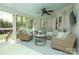 Relaxing screened porch with ceiling fan and comfortable seating for enjoying the outdoors at 6910 Green Turtle Dr, Charlotte, NC 28210