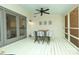 Outdoor dining on the screened porch, accessible from the kitchen with ceiling fan at 6910 Green Turtle Dr, Charlotte, NC 28210