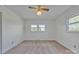 A bright bedroom features neutral carpet and a double window at 70 Liberty Church Rd, Taylorsville, NC 28681