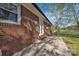Brick exterior showcasing a concrete patio area perfect for outdoor enjoyment at 70 Liberty Church Rd, Taylorsville, NC 28681