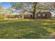 Lovely brick home with a large front yard and mature trees providing ample shade at 70 Liberty Church Rd, Taylorsville, NC 28681