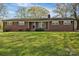 Charming single-story brick home with a well-maintained lawn and inviting curb appeal at 70 Liberty Church Rd, Taylorsville, NC 28681