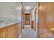 A hallway with wood trim, a built-in bookcase, and doors at 70 Liberty Church Rd, Taylorsville, NC 28681