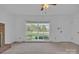 Spacious living area with large windows showcasing a view of the well manicured front yard at 70 Liberty Church Rd, Taylorsville, NC 28681