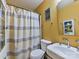 Bathroom with a shower/tub and bright yellow walls at 7024 Sunman Rd, Charlotte, NC 28216