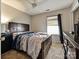 Bedroom with a ceiling fan and a dark wood bedroom set at 7024 Sunman Rd, Charlotte, NC 28216