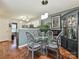 Cozy dining area with glass table, unique chairs, and stylish decor near the kitchen at 7024 Sunman Rd, Charlotte, NC 28216