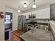 Functional kitchen featuring stainless steel appliances, granite countertops, and ample cabinet space at 7024 Sunman Rd, Charlotte, NC 28216