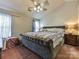 Comfortable main bedroom with a ceiling fan and ample natural light at 7024 Sunman Rd, Charlotte, NC 28216