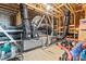 Unfinished attic space showing ductwork and beams. Offers potential for storage or customization at 7633 Tanglewood Way, Denver, NC 28037