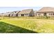 Large, grassy backyard enclosed by a black fence with a well-maintained lawn at 7633 Tanglewood Way, Denver, NC 28037