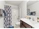 Well-lit bathroom featuring a tub/shower combo, vanity, and modern fixtures creates a functional space at 7633 Tanglewood Way, Denver, NC 28037