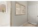 Bright bathroom with glass enclosed shower with custom tile and window at 7633 Tanglewood Way, Denver, NC 28037