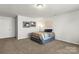 Cozy bedroom featuring neutral walls, carpet, and stylish decor for a comfortable and inviting space at 7633 Tanglewood Way, Denver, NC 28037