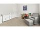 Bright Bedroom with chair, ottoman, and window at 7633 Tanglewood Way, Denver, NC 28037
