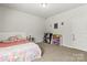 Bedroom with neutral carpet, white walls, and decor at 7633 Tanglewood Way, Denver, NC 28037