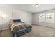 Bright bedroom with plush carpet, ample natural light, and calming decor creates a serene retreat at 7633 Tanglewood Way, Denver, NC 28037