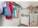 Organized closet with hanging racks and a dresser for storage at 7633 Tanglewood Way, Denver, NC 28037