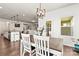 Open-concept home featuring a dining area with views to the kitchen and living room; perfect for entertaining at 7633 Tanglewood Way, Denver, NC 28037