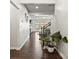 Open-concept entryway featuring hardwood floors, modern decor, and bright lighting at 7633 Tanglewood Way, Denver, NC 28037