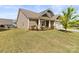 The exterior of this house is well-maintained with healthy lawn and landscaping at 7633 Tanglewood Way, Denver, NC 28037