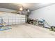 Spacious garage with shelving units, providing ample storage and organizational options at 7633 Tanglewood Way, Denver, NC 28037