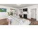 Cozy living room features a fireplace, modern decor, and comfortable seating at 7633 Tanglewood Way, Denver, NC 28037