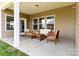 Covered patio with stylish outdoor furniture, perfect for relaxing or entertaining at 7633 Tanglewood Way, Denver, NC 28037