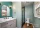 Bathroom featuring a stylish vanity, mirror, and glass-enclosed shower at 8025 Cliffside Dr, Charlotte, NC 28270