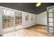 Bedroom with floor-to-ceiling windows and a door with access to a beautiful deck at 8025 Cliffside Dr, Charlotte, NC 28270