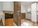 Bright entryway with wood-look floors, rustic wood accent and front door with sidelights at 8025 Cliffside Dr, Charlotte, NC 28270