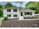 Traditional two-story home with black shutters, freshly painted and landscaping in front yard at 8025 Cliffside Dr, Charlotte, NC 28270