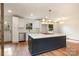 Well-lit kitchen featuring marble countertops, stainless steel appliances, and modern lighting fixtures at 8025 Cliffside Dr, Charlotte, NC 28270