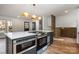 Kitchen with marble countertops, a large island with oven, and stainless steel appliances at 8025 Cliffside Dr, Charlotte, NC 28270