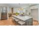 Modern kitchen with a large center island and stainless steel appliances, and stylish lighting at 8025 Cliffside Dr, Charlotte, NC 28270