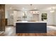 Bright kitchen featuring marble countertops, stainless steel appliances, and modern lighting fixtures at 8025 Cliffside Dr, Charlotte, NC 28270