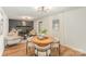 Stylish living room with a brick fireplace, modern furnishings, and a neutral color palette at 8025 Cliffside Dr, Charlotte, NC 28270
