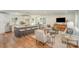 Open-concept living room with a kitchen island and sleek modern furniture at 8025 Cliffside Dr, Charlotte, NC 28270