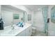 Bright bathroom featuring a double sink vanity, a shower-tub combo, and neutral decor at 818 N Naughton St, Chester, SC 29706