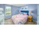 Bright bedroom with colorful decor, a cozy bed, and ample natural light at 818 N Naughton St, Chester, SC 29706