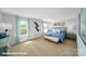 Bedroom showcasing a king-sized bed, bench, and natural light from the large window at 818 N Naughton St, Chester, SC 29706