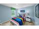bedroom featuring blue walls, playful decor, and ample natural light at 818 N Naughton St, Chester, SC 29706