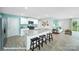 Kitchen boasts island with barstool seating with views of the living room and stainless appliances at 818 N Naughton St, Chester, SC 29706