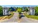 Scenic community entrance with charming guard houses and well-manicured landscaping at 8715 Gladden Hill Ln, Fort Mill, SC 29715