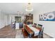 Elegant dining area featuring a chandelier and view into the kitchen at 8715 Gladden Hill Ln, Fort Mill, SC 29715