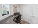 Functional home office area with a granite countertop desk, dual monitors and natural light at 8715 Gladden Hill Ln, Fort Mill, SC 29715