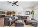 Open-concept living space featuring a comfortable sectional sofa and views into the kitchen and dining areas at 8715 Gladden Hill Ln, Fort Mill, SC 29715