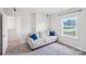 Cozy living room with neutral sofa, bright window, and lots of natural light at 8715 Gladden Hill Ln, Fort Mill, SC 29715